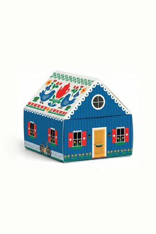 Blue matchbox cottage house with red door and windows, decorative roof pattern