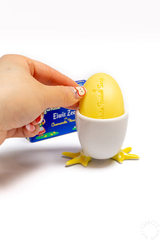 Egg soap cup with white cup and yellow star feet; hand sets in a yellow egg half
