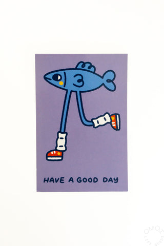 Purple postcard with blue cartoon fish and 'HAVE A GOOD DAY' text