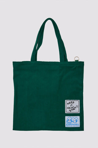 Dark green tote bag with small square logo patch on back, top handles