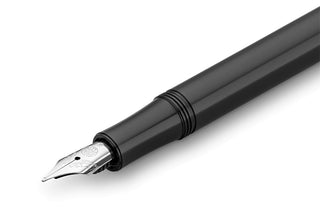 Black fountain pen close-up of medium nib and feed housing