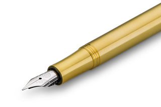 Brass fountain pen with medium nib and metal grip detail