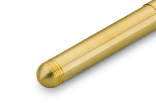 Brass fountain pen barrel close-up with ribbed grip section