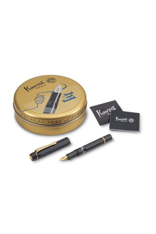 Kaweco piston fountain pen kit with black barrel, gold nib, and storage tin