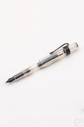 Clear barrel fountain pen with black nib and clip, medium nib.