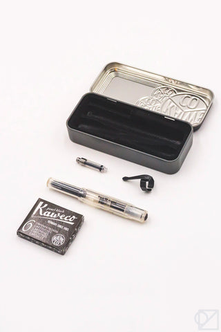 Black crystal fountain pen set accessories with metal tin, cartridges, and medium nib.