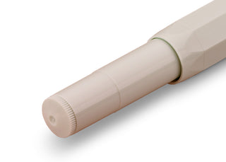 Light cream rollerball pen with cap end, close-up view of barrel