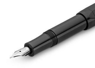 Black fountain pen with close-up medium nib and nib tip