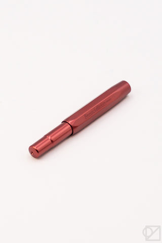 Ruby red fountain pen with black center band and gold clip