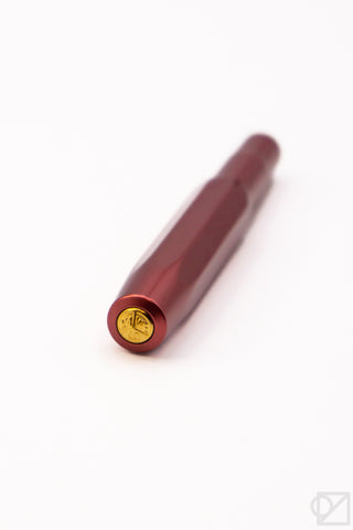 Ruby red fountain pen with gold end cap and clip