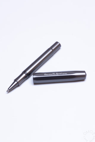 Anthracite rollerball pen with metal clip beside presentation box