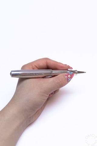 Kaweco AL Sport rollerball pen uncapped, hand holding with star grip at tip