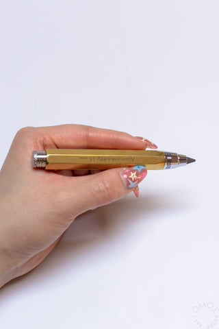 Brass clutch pencil with knurled grip rings and metal lead tip