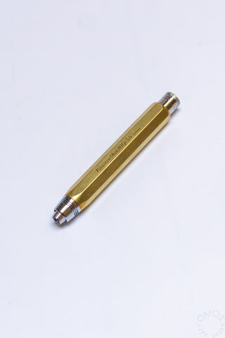 Raw brass clutch pencil side view with printed markings and lead tip