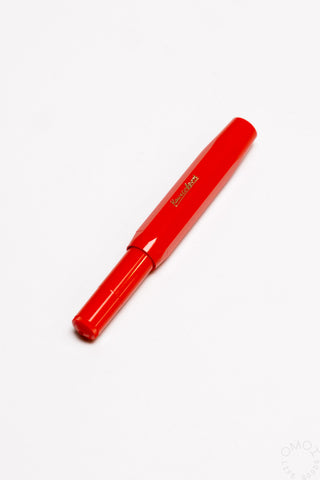 Red fountain pen with gold medium nib and glossy barrel finish