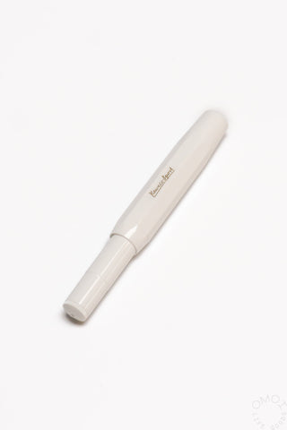 White fountain pen with gold logo on the barrel and capped tip