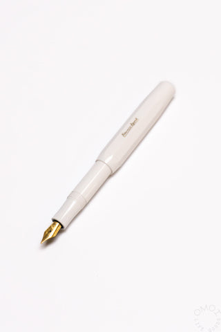 White fountain pen with gold medium nib and slim barrel design