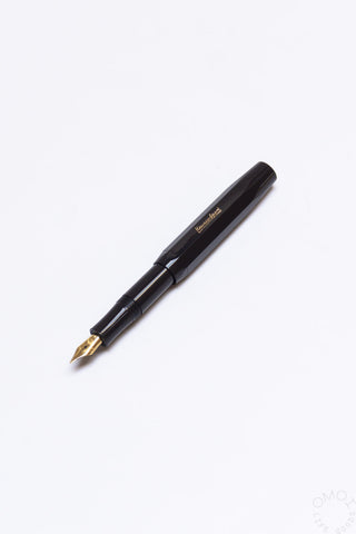 Black fountain pen with gold medium nib and glossy barrel finish