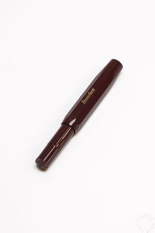 Bordeaux Kaweco Sport rollerball pen with gold clip and tapered nib