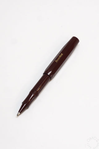 Dark brown Kaweco Sport rollerball pen with gold clip and pointed nib