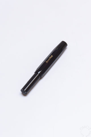 Black Kaweco Sport rollerball pen, capped end with gold branding and clip
