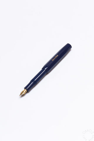 Navy blue fountain pen with gold medium nib and matching clip