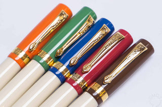 Student rollerball pens grouped with gold clips and caps in orange, green, blue, red