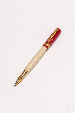 Student rollerball pen with beige barrel and dark red cap with gold accents