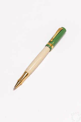 Student rollerball pen with beige barrel and green band with gold clip