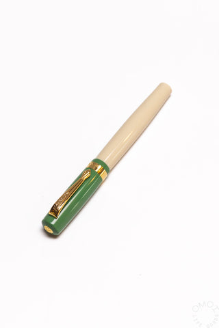 Student rollerball pen with beige barrel and green band with gold tip and clip