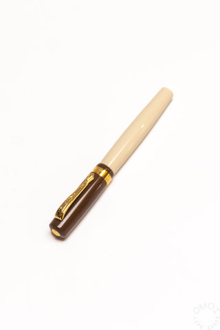 Dark brown and cream student rollerball pen with gold accents