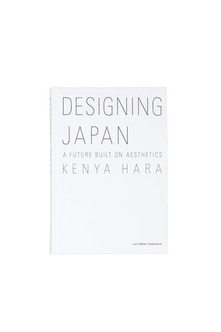 White paperback book cover with large “DESIGNING JAPAN” title and author text
