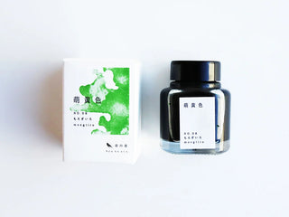 Moegiiro ink bottle and matching white box with green watercolor artwork.