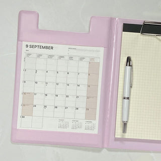 A5 field pad refill page in pink binder: open-dated monthly calendar grid