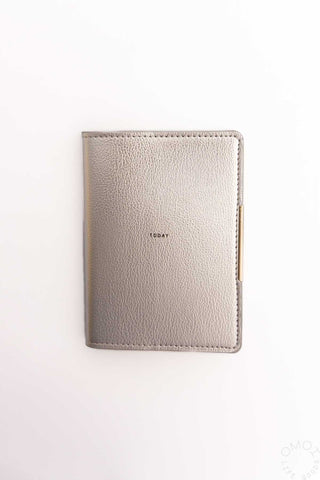 Silver textured pocket log diary cover with stitched edges and small center logo