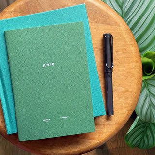 Two B6 notebooks: green and teal covers, each with “green” text and small icons