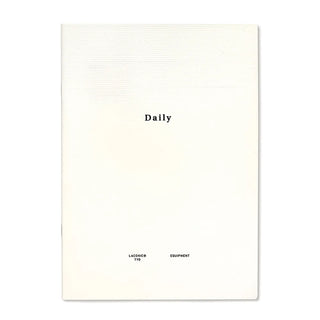 White Daily planner notebook cover with centered “Daily” title and brand marks.