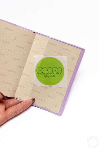 Opened Purple Pocket Log Diary with inner pages and green circular logo