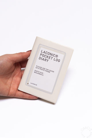 Hand holding cream Pocket Log Diary with LACONIC Pocket Log Diary on front