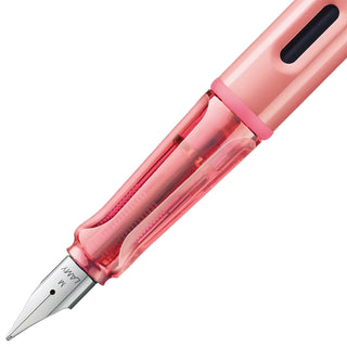 Flamingo pink fountain pen showing clear ink reservoir and fine steel nib