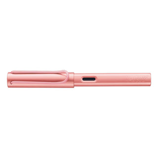 Flamingo pink fountain pen with integrated grip, side cutout, and ink refill window