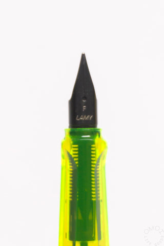 Fine nib tip close-up on LAMY AL-Star fountain pen with green grip section