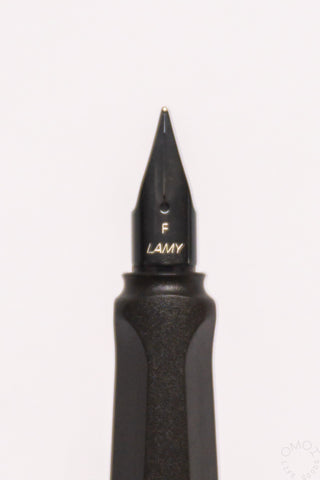 Close-up of LAMY fine nib marked "F" on a black fountain pen