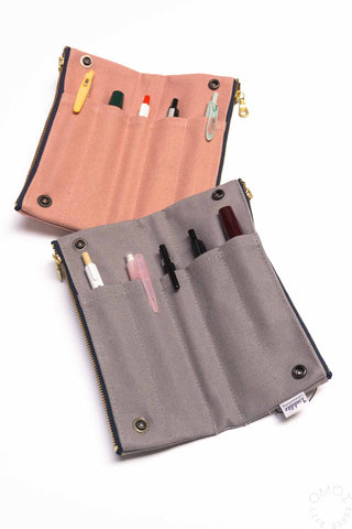 Pink and grey fabric bendy pen case with snap pockets and pens inside