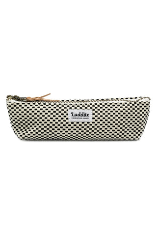 Black-and-white checkered LUDDITE canvas boat pen case with gold zipper and label.