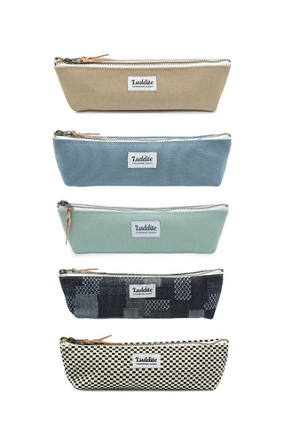 Assorted LUDDITE boat pen cases, beige, blue, sage, navy patchwork, and checkered.