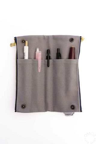 Grey bendy pen case with two row pen pockets and snap button corners