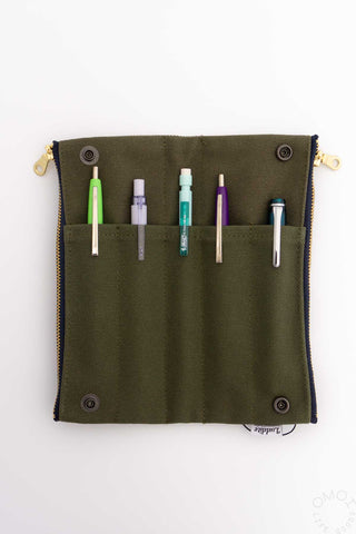 Khaki bendy pen case open flat with four pen slots and snap button ends