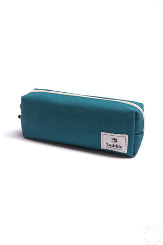Teal canvas box pen case with zipper, white trim, and front brand patch