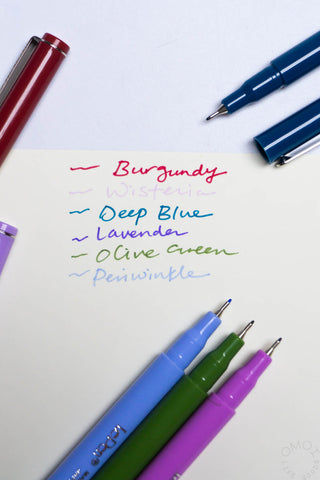 Color pen set with handwritten color names and four pens in burgundy, deep blue, lavender, olive.